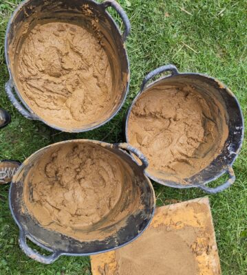 Adults playing with mud